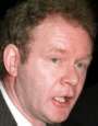 Hey what makes Martin McGuinness tick? That alarm clock and candle combo, in his inside pocket!